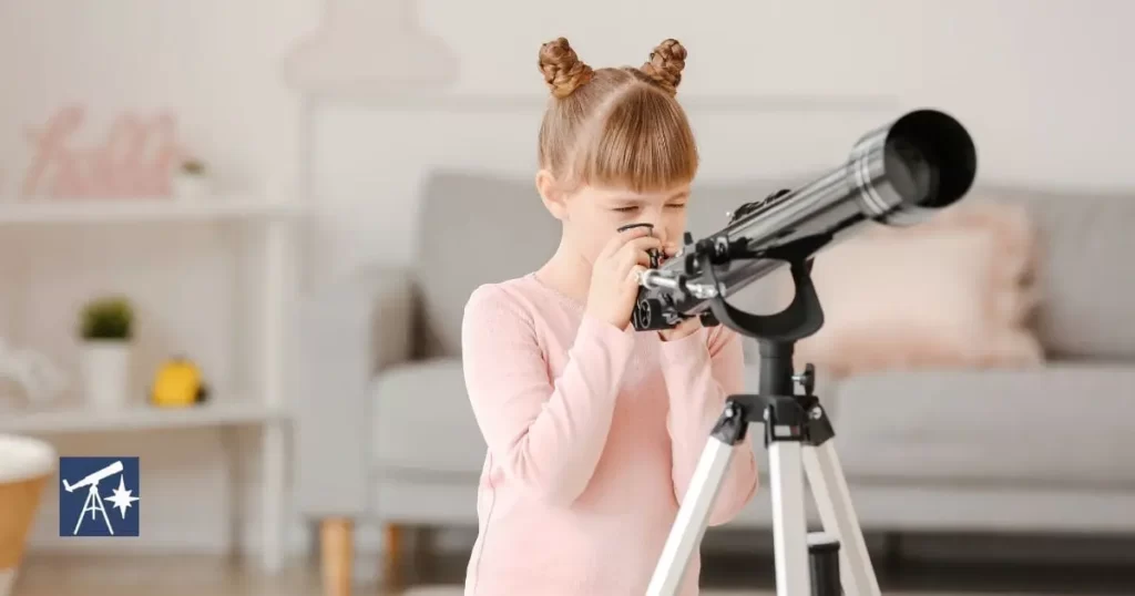 A child using a refractor with alt-az mount