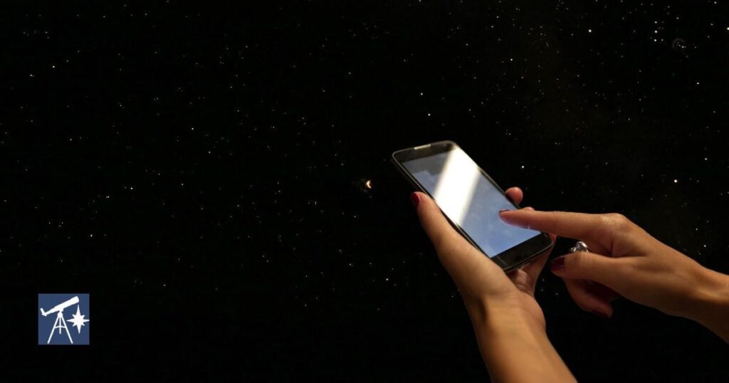 person looking for app on device for astronomy